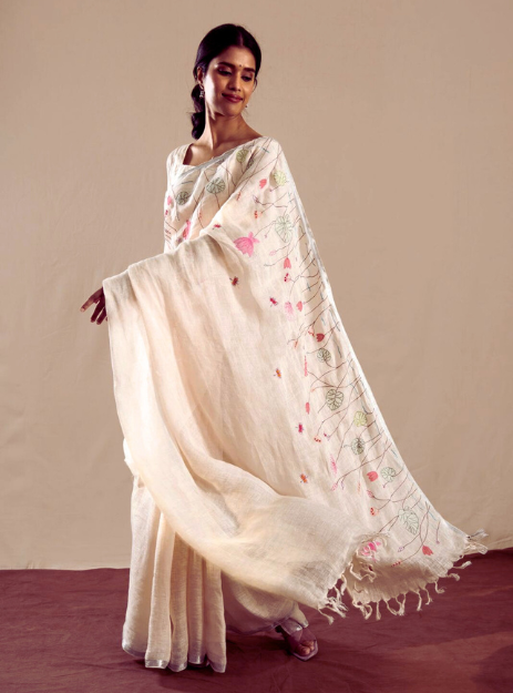 Mridula- off-white pure linen saree adorned with soft pastel thread hand embroidery.